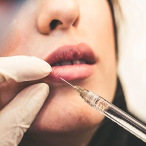 A woman getting a lip injection